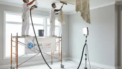Painter removing popcorn ceiling in Mesa AZ home for smooth modern finish
